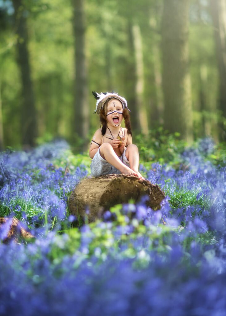 portrait of a boy from family and kids photoshoot in amazing bluebells located in Nottingham