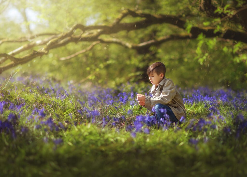 teenage boy in a bluebell woods on a family photography session in Nottingham