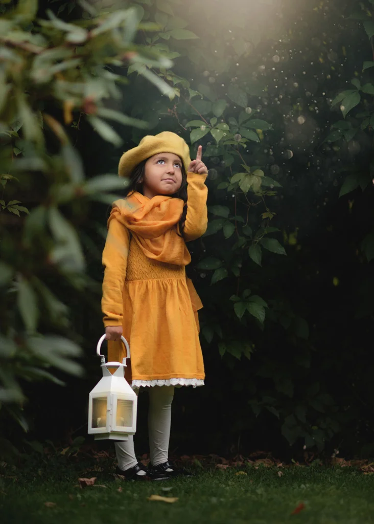 Girl holding a lantern during a creative photoshoot for kids in Nottingham.