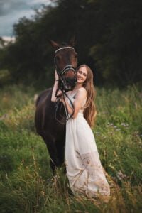 Heartwarming Equine Bond: Woman and Horse in Countryside Photoshoot