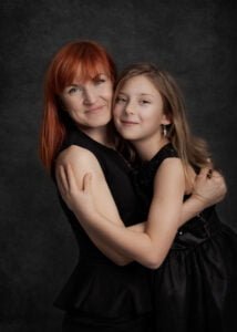 Mother and daughter embracing during a studio photoshoot in Nottingham