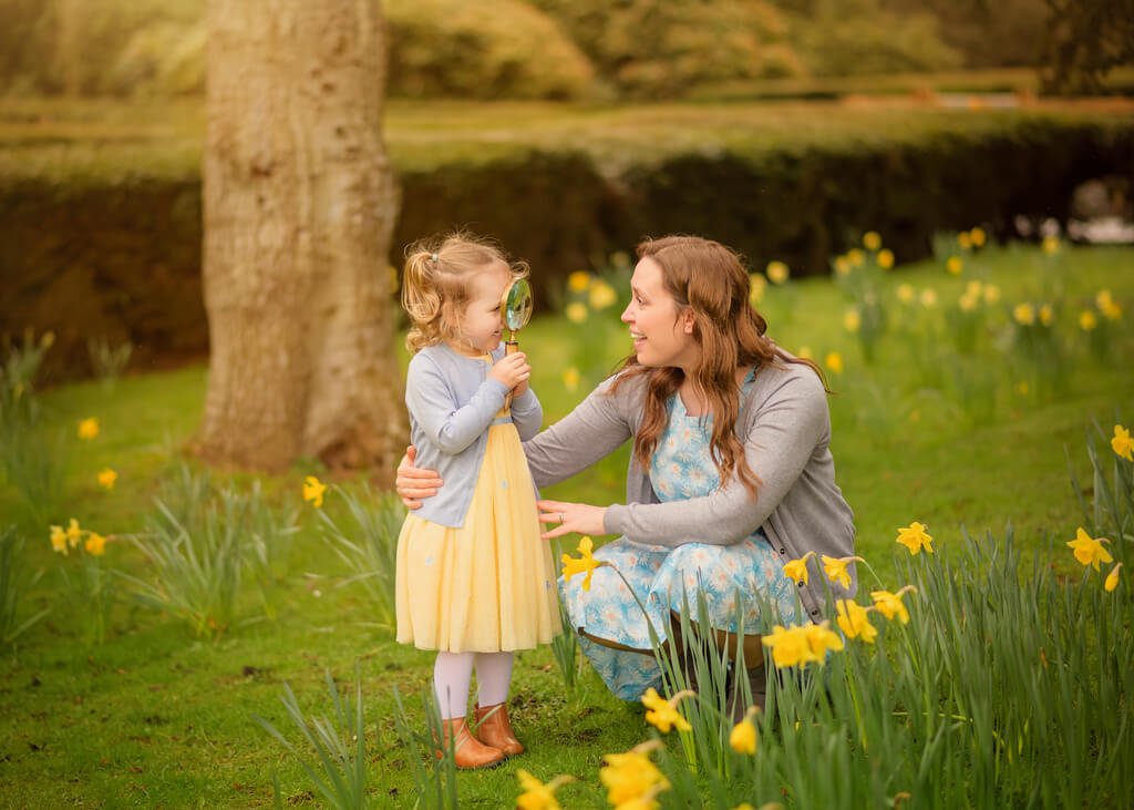 A heartwarming scene of a mother and daughter immersed in the beauty of spring among blooming daffodils in Nottingham. The vibrant yellow flowers create a stunning backdrop as the duo embraces the season's charm. The image captures their joyful connection and the serenity of the natural surroundings. This picturesque moment evokes a sense of love, togetherness, and appreciation for the wonders of spring.