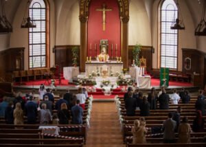 Church altar and congregation during a First Holy Communion ceremony in Nottingham.