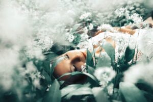 Professional woman portrait in tranquil white flowers, Nottingham.