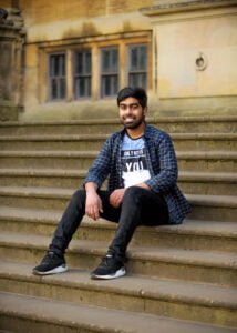 Man smiling on stone steps during Nottingham friendship photography session