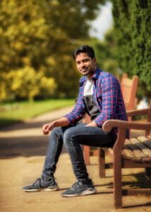 Man sitting on a park bench in Nottinghamshire during a friends photoshoot