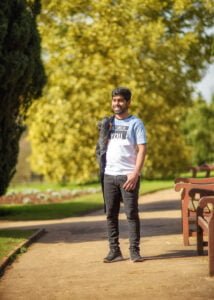 Man standing on a path with jacket over shoulder during a Nottinghamshire friends photoshoot
