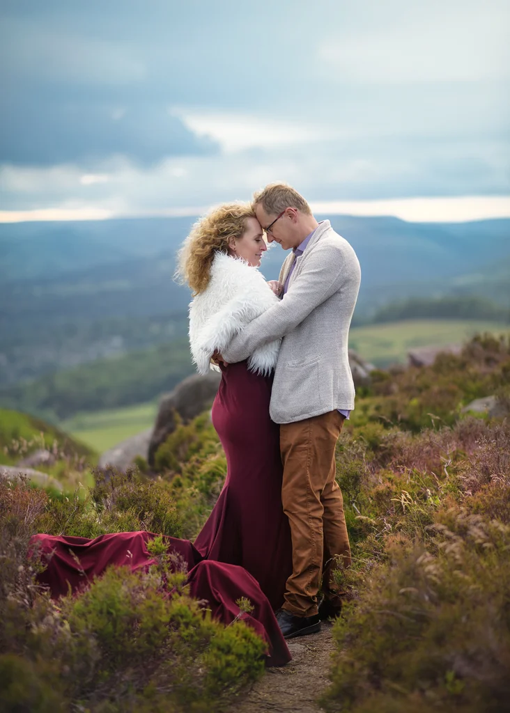 Couple sharing a romantic embrace in an outdoor anniversary photoshoot in Nottingham