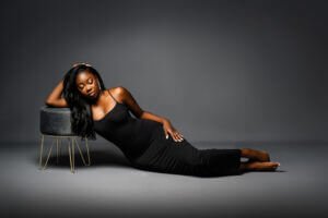 Confident repose: A woman lies in contemplative elegance, her poised relaxation a celebration of her 40th year, embodying confidence and grace.Confident repose: A woman lies in contemplative elegance, her poised relaxation a celebration of her 40th year, embodying confidence and grace.