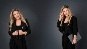 Professional businesswoman posing confidently in formal black attire during a professional business photoshoot, ideal for branding and corporate profiles.