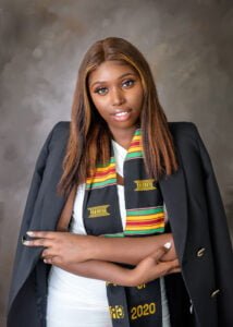 Confident graduate in regalia from Nottingham, showcasing her academic success and readiness for future challenges.