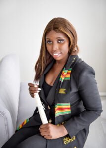 Confident Nottingham graduate holding her diploma, ready to embark on her professional journey