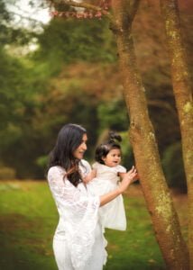 A playful moment between a mother and her baby during a Mother and Child Photoshoot in Nottingham.