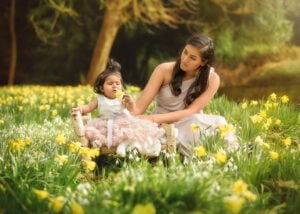 A mother lovingly watching her child during a Mother and Child Photoshoot in Nottingham’s daffodil fields.