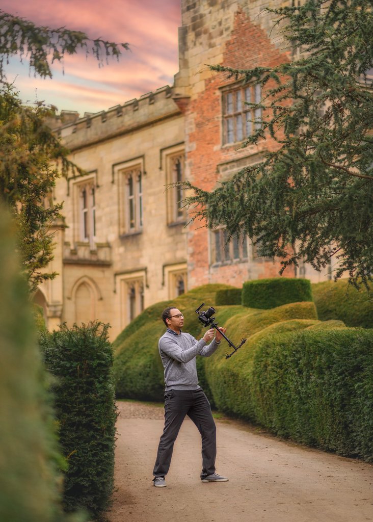 A focused videographer captures moments at Elvaston Castle, showcasing the merging of historic beauty and modern storytelling in Nottingham.
