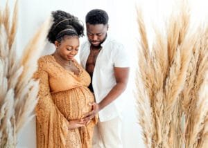Couple lovingly looking at each other during a maternity photo session in Nottingham.