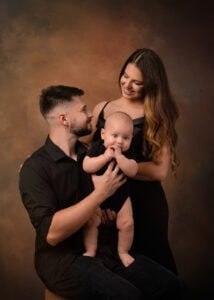 Professional family photographer captures a joyful family portrait in Nottingham.