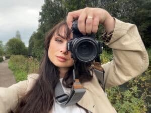 Female Nottingham graduation photographer taking a selfie with camera