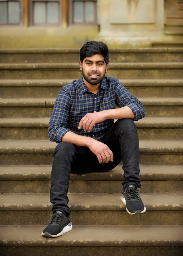 man sitting on floor while leaning on wall | Photography poses for men,  Poses for men, Male poses