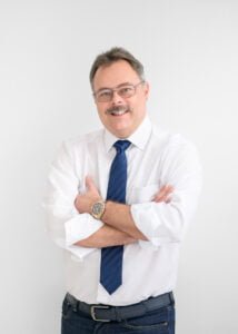 Experienced professional in business attire posing confidently, representing seasoned expertise in Nottingham