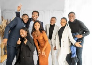 Joyful family and friends celebrating graduation in Nottingham, full of laughter and cheerful poses.