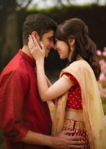 engagement portrait inspiration, red and golden colours. spring photoshoot in a garden