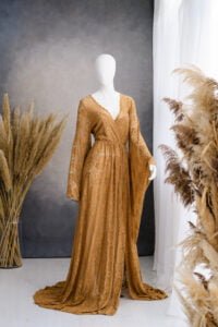 Expectant mother in blush maternity gown during studio photoshoot – maternity photoshoot dresses Nottingham