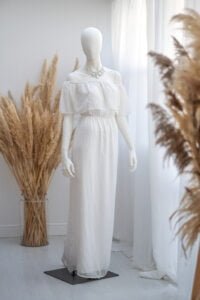 Elegant off-shoulder white dress for women’s photoshoots in natural light studio