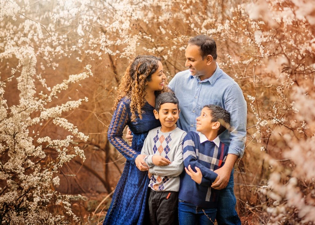 Candid family portrait in Elvaston Castle Park during a spring photography session