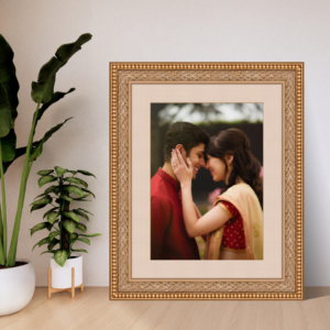 Couple photography portrait in a traditional frame displayed on a modern table, capturing a romantic moment.