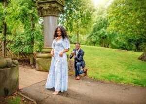 Surprise proposal during an outdoor couple photoshoot in Nottingham, with the man on one knee.