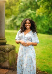 Woman smiling during her outdoor couple photography session in Nottingham.