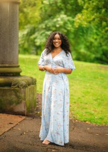 Woman posing near a pillar during her couple photography session in Nottingham.