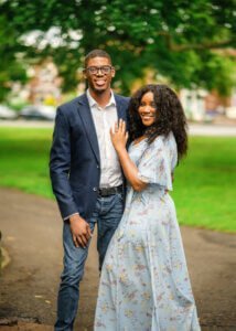 Engaged couple posing together during their outdoor couple photoshoot in Nottingham.
