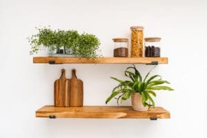 Wooden shelves with plants and pantry items, high-quality Nottingham product photography for small businesses.