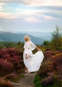 Woman in lace maternity photoshoot dress Nottingham countryside