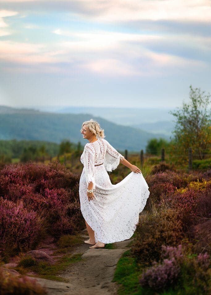 Woman in lace maternity photoshoot dress Nottingham countryside